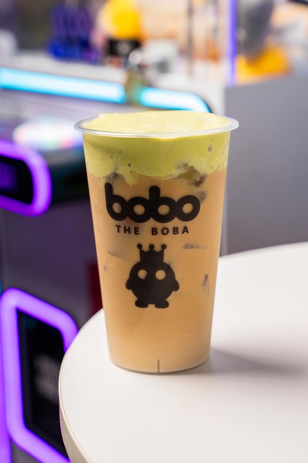Milk tea topped with matcha foam