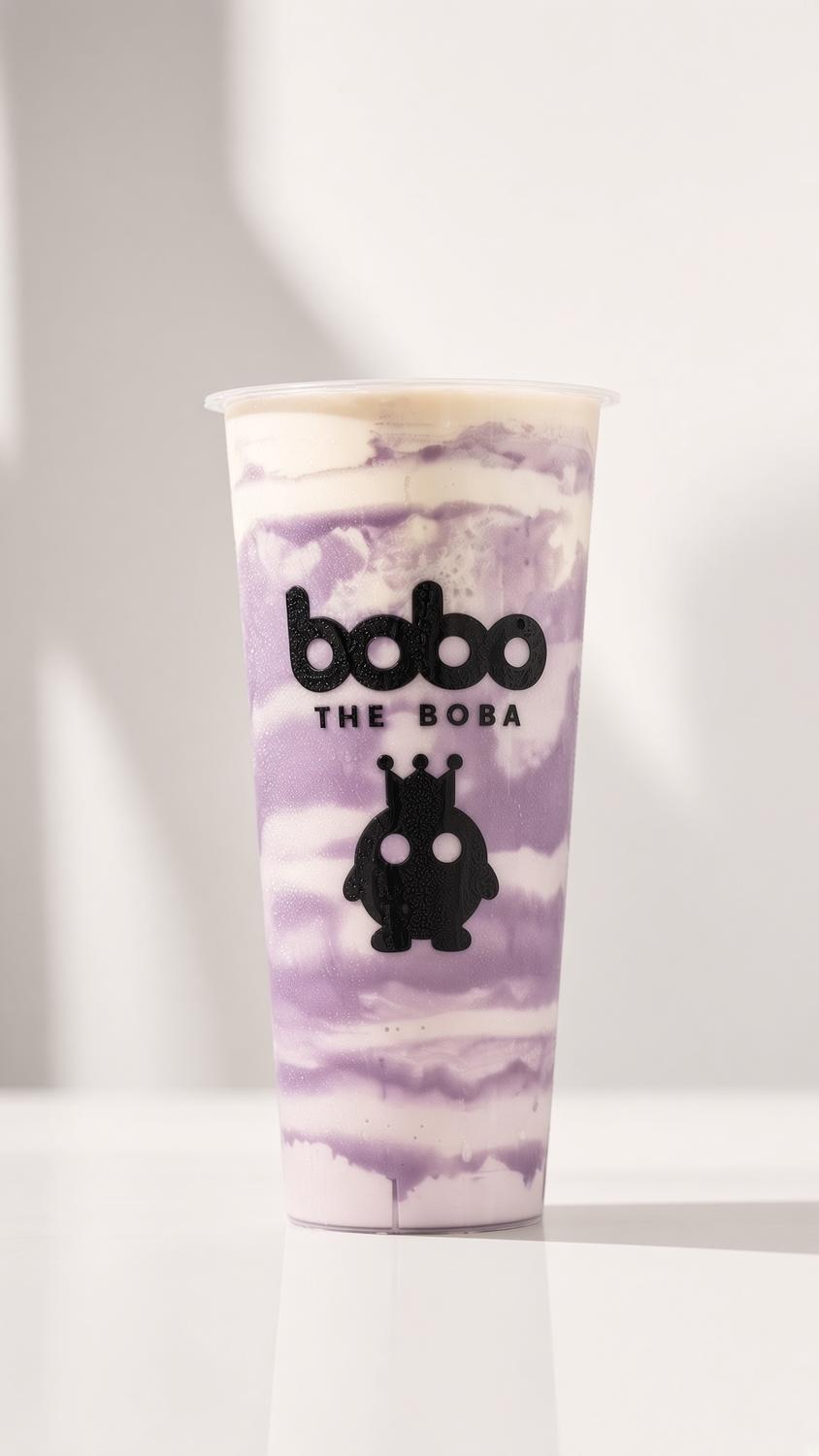 Taro milk swirl boba drink in a Bobo The Boba cup