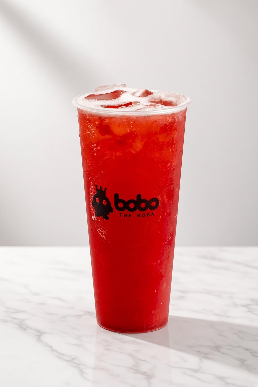 Iced strawberry tea on a marble table
