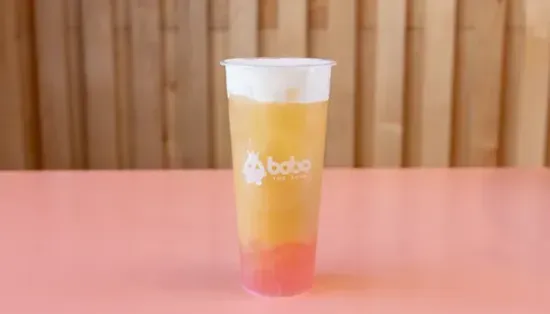 Peach bubble tea with pink crystal boba